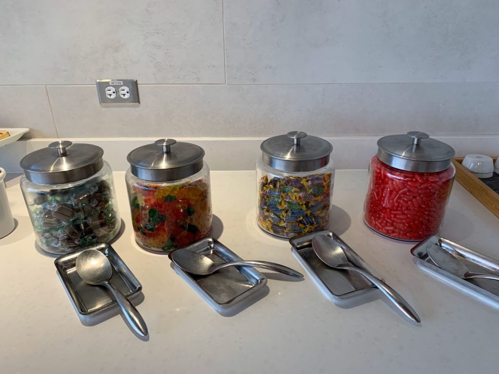 a group of glass containers with different colored objects