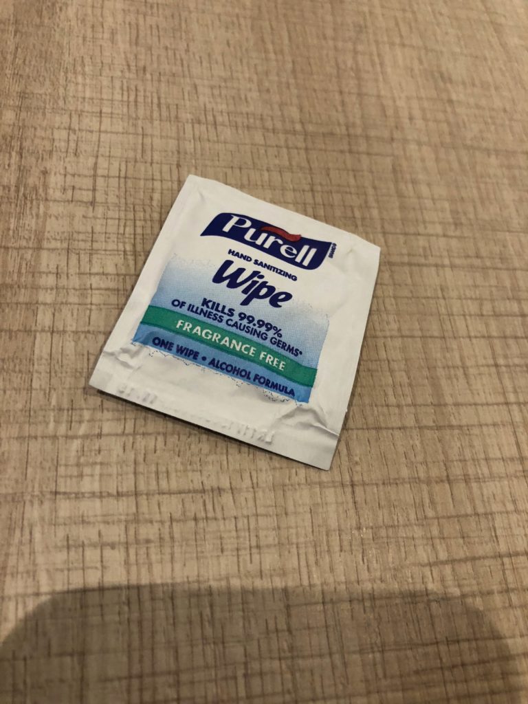 a small white and blue packet of wipes