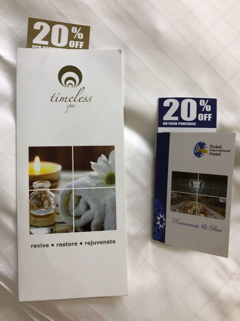 a two brochures on a bed