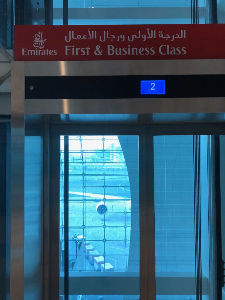 an elevator with a sign and a window