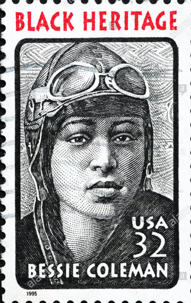 a stamp with a woman wearing a helmet