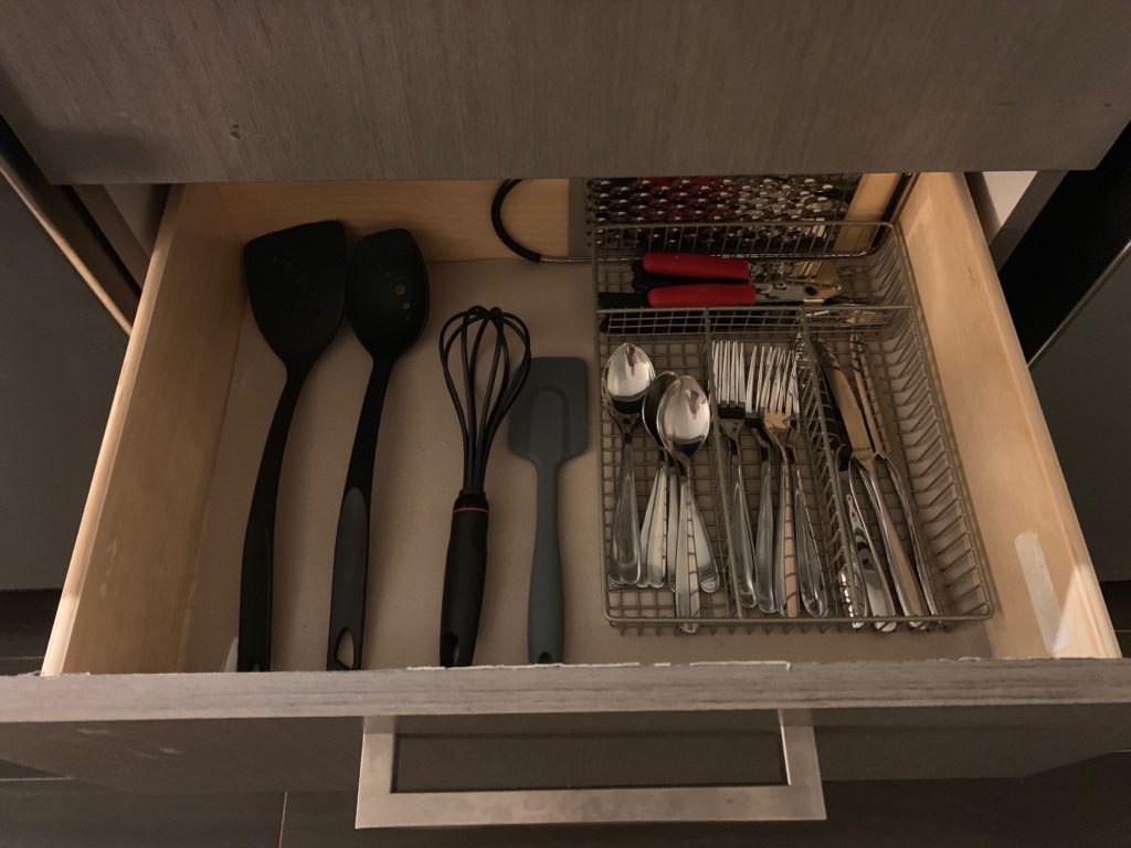 a drawer full of kitchen utensils