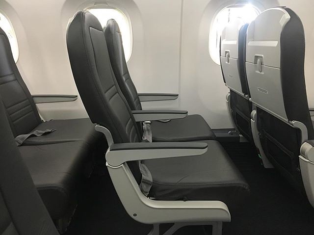 seats in an airplane with windows