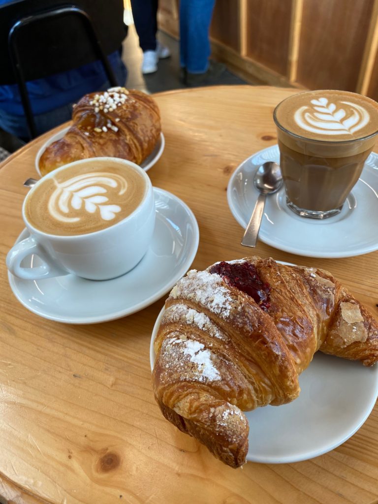 a croissants and coffee on a table