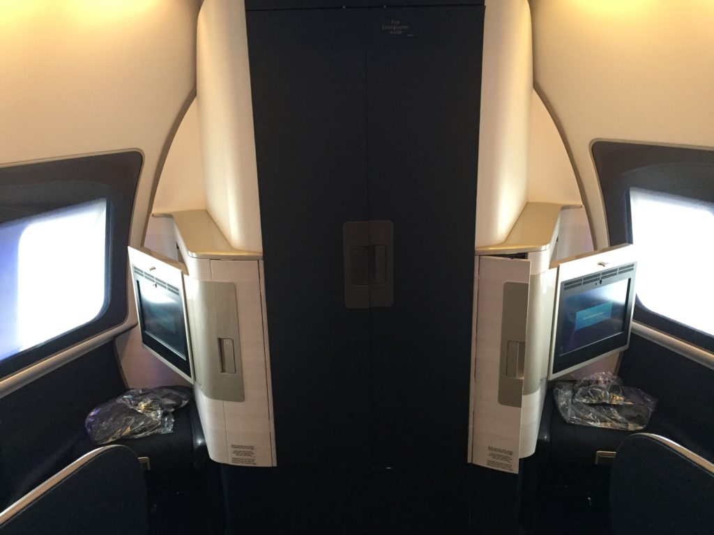 a door with monitors on the side of the plane