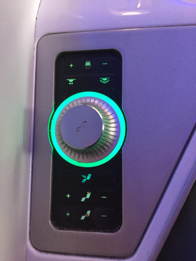 a control panel with a green light