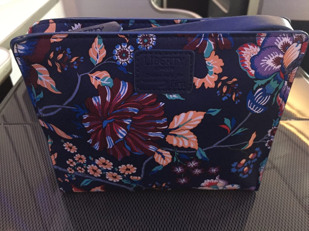 a blue bag with flowers on it
