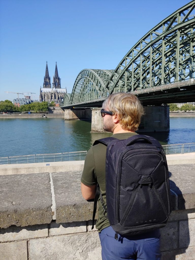 a man looking at a bridge
