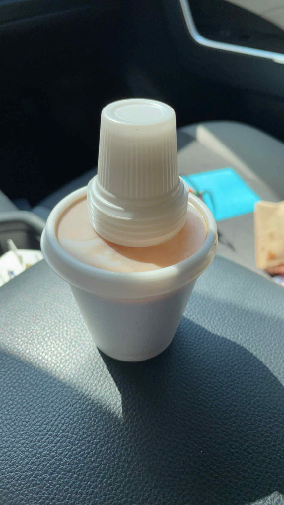 a white container with a white cap on top of it