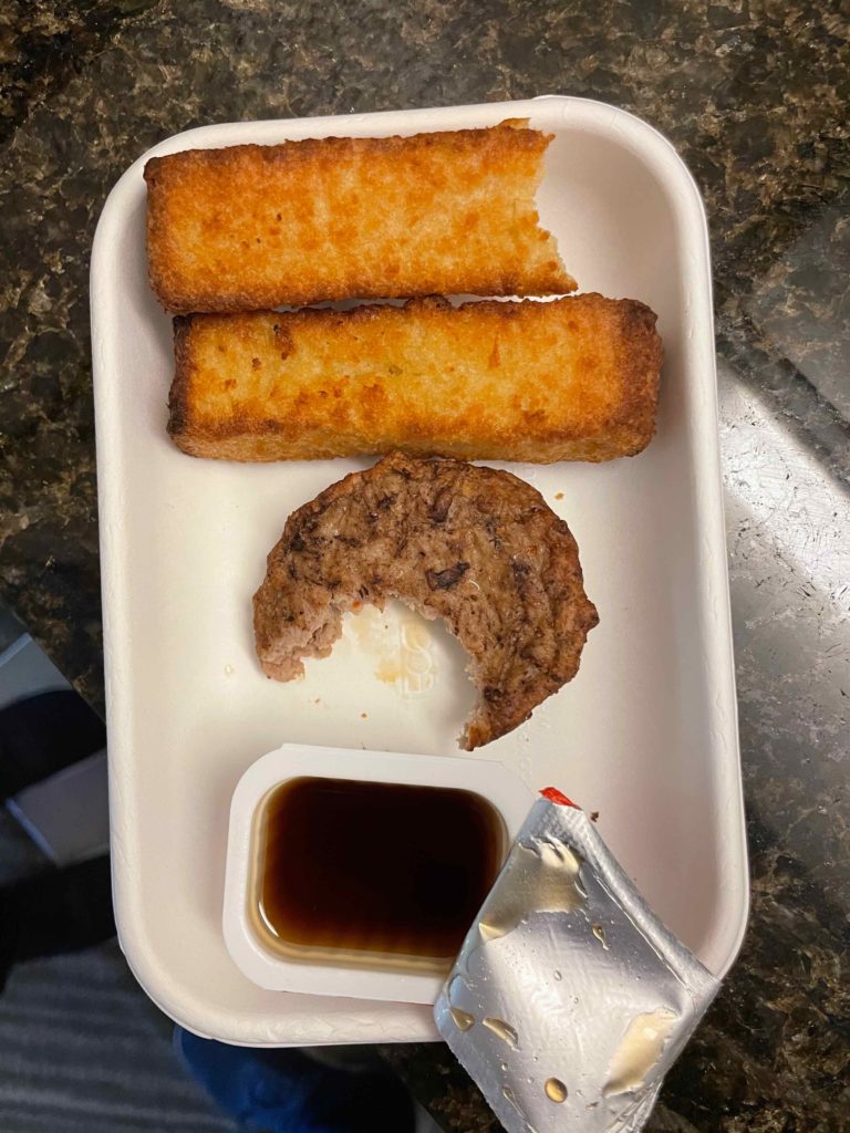 a plate of food with a bite taken out of it