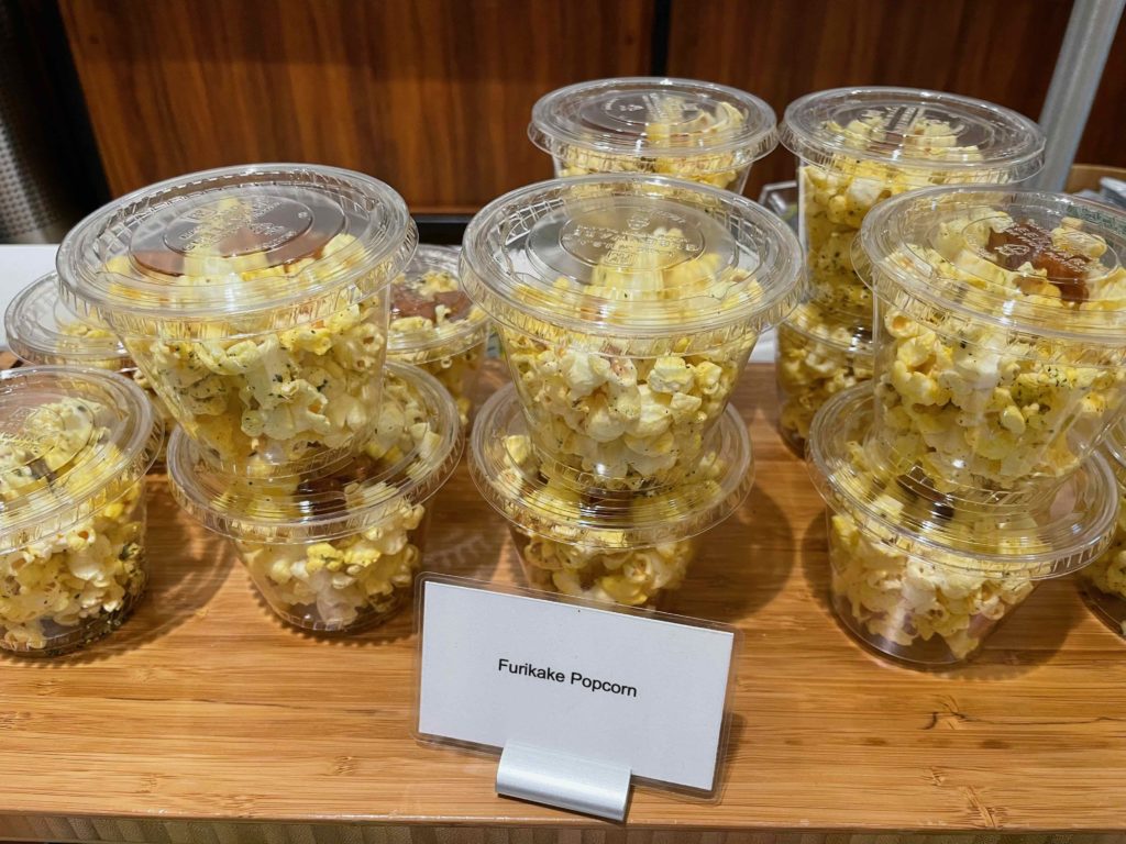 a group of plastic cups of popcorn