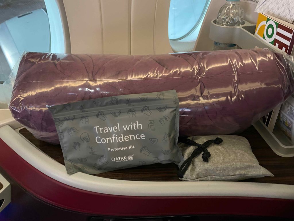 a bag and a tube on a plane