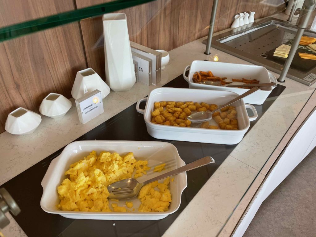 food in a buffet with a glass wall