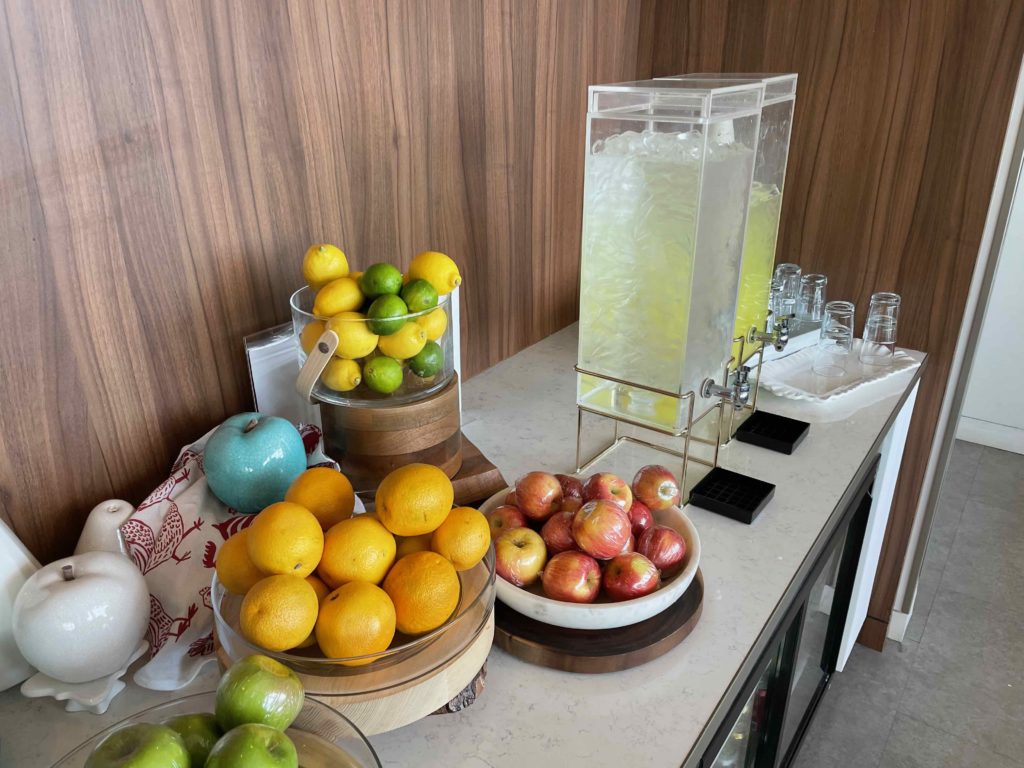 a table with bowls of fruit