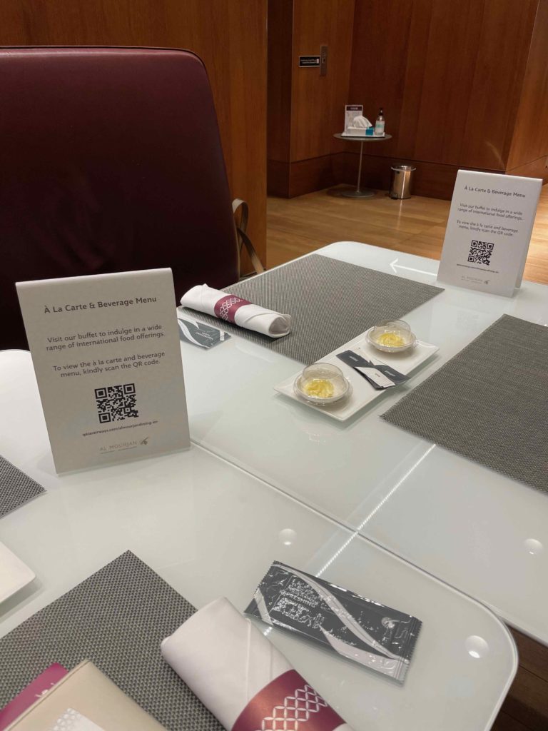 a table with a menu and a napkin on it