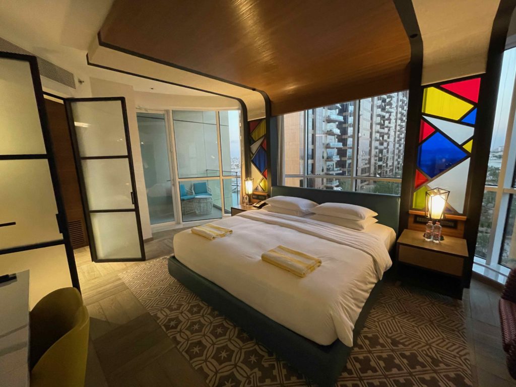 a bed with colorful windows