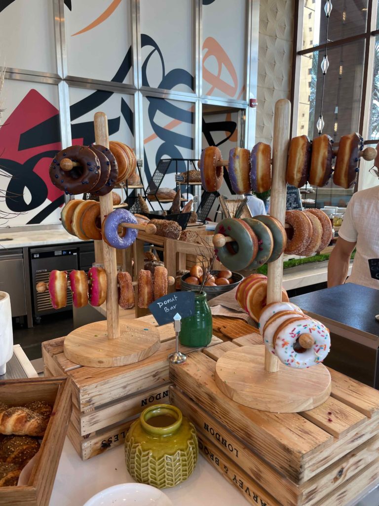 a display of doughnuts on a stand